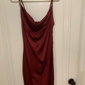 Burgundy cocktail dress, falls just above the ankles with a slit.